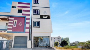 A modern hotel with a sign reading "HOTEL O" and a logo above the entrance. - Hotel O Snist University Hyderabad (Hyderabad)
