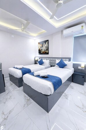 Chambre Deluxe Double ou avec lits jumeaux | Literie de qualité supérieure, minibar, coffres-forts dans les chambres