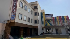 A building with a sign reading "PANNA PALACE GARDEN BANQUET ROOMS." - Panna Palace (Mathura)