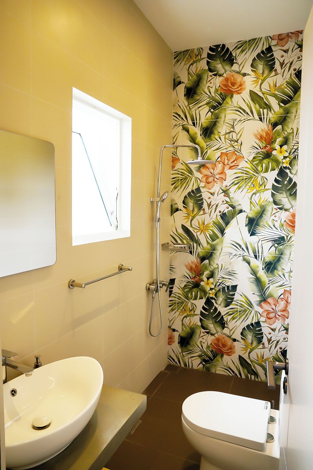A bathroom with a sink, toilet, and shower.