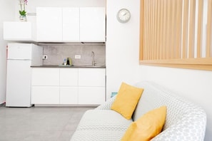 Deluxe Apartment, 1 Queen Bed, Patio, Courtyard View | Living area - Eos Elegant Apartment & Suites (Syracuse)