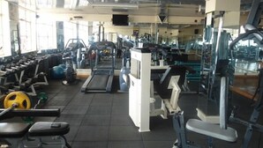 A gym with various exercise equipment, including treadmills, weight machines, and free weights. - Legacy Star Hotel Chuka (Chuka)