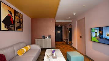 Suite, 1 King Bed | Living area | 50-inch Smart TV with satellite channels