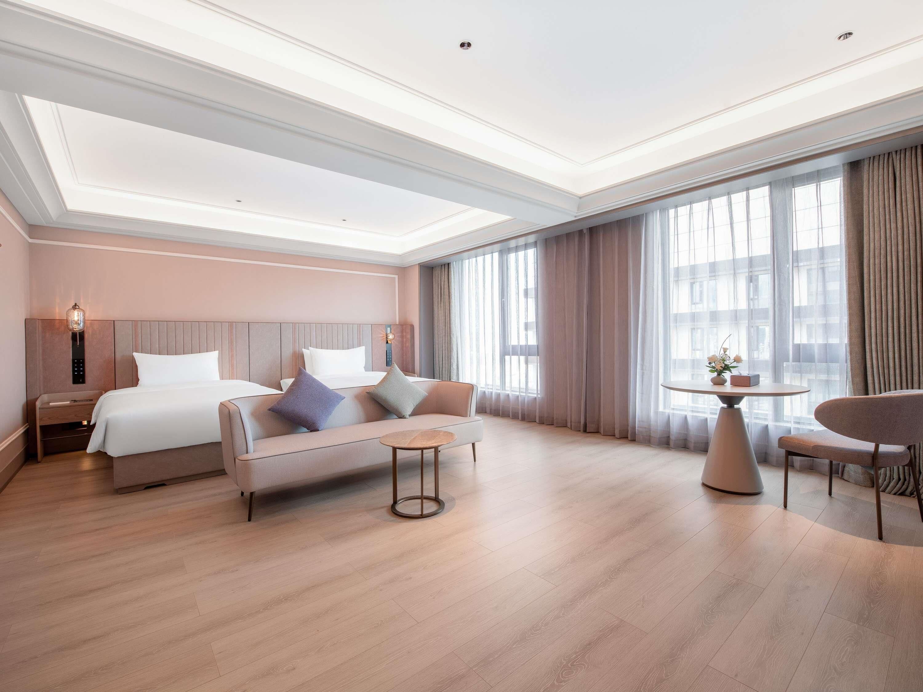Habitación ejecutiva, 2 camas individuales | Edredón, artículos del minibar gratis y cortinas blackout 