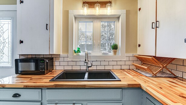 A kitchen with a wooden countertop, a built-in sink, and cabinets. - 1 Mi to Rogue River: Walkable Grants Pass Retreat (Grants Pass)