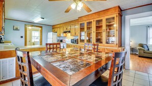 A spacious kitchen with a large island, wooden cabinets, and a ceiling fan. - 'the Vineyard House' - 2 Mi to Dtwn Mount Airy! (Mount Airy)