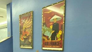 A waiting area with leather chairs and two posters on the wall. - Goiânia Palace Hotel (Goiânia)