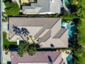 A residential area with multiple houses, each featuring a tiled roof and a swimming pool. - Stunning Private Pool Home Overlooking the 8th and 9th Double Fairway in PGA (La Quinta)