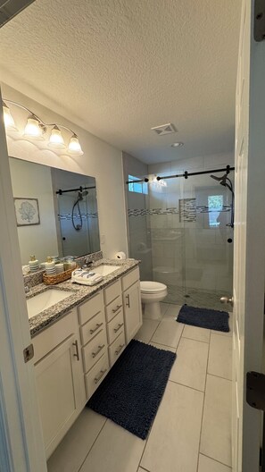 Shower, hair dryer, towels, soap