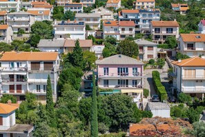 A densely packed residential area with multi-story buildings, balconies, and a mix of architectural styles. - Seaview Apartment With Jacuzzi Ivano (Novi Vinodolski)