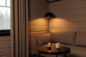 Habitación cuádruple, vistas al complejo turístico | Zona de estar