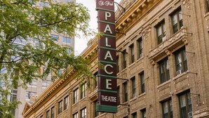 A theater building with a marquee sign reading 'PALACE THEATRE.' - Roami at The Fitz (St. Paul)
