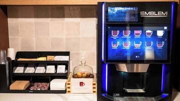 A coffee machine with a digital display and a selection of coffee options.