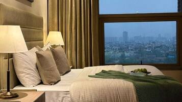 Luxury Apartment, City View | Laptop workspace, iron/ironing board, free WiFi