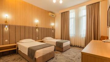 Double or Twin Room | Blackout drapes, iron/ironing board, free WiFi