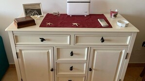 A white cabinet with drawers and a small white appliance on top. - The Terrace on the Gulf of Alghero 2 (Alghero)