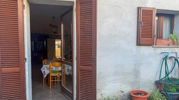 Apartamento | Restaurante al aire libre
