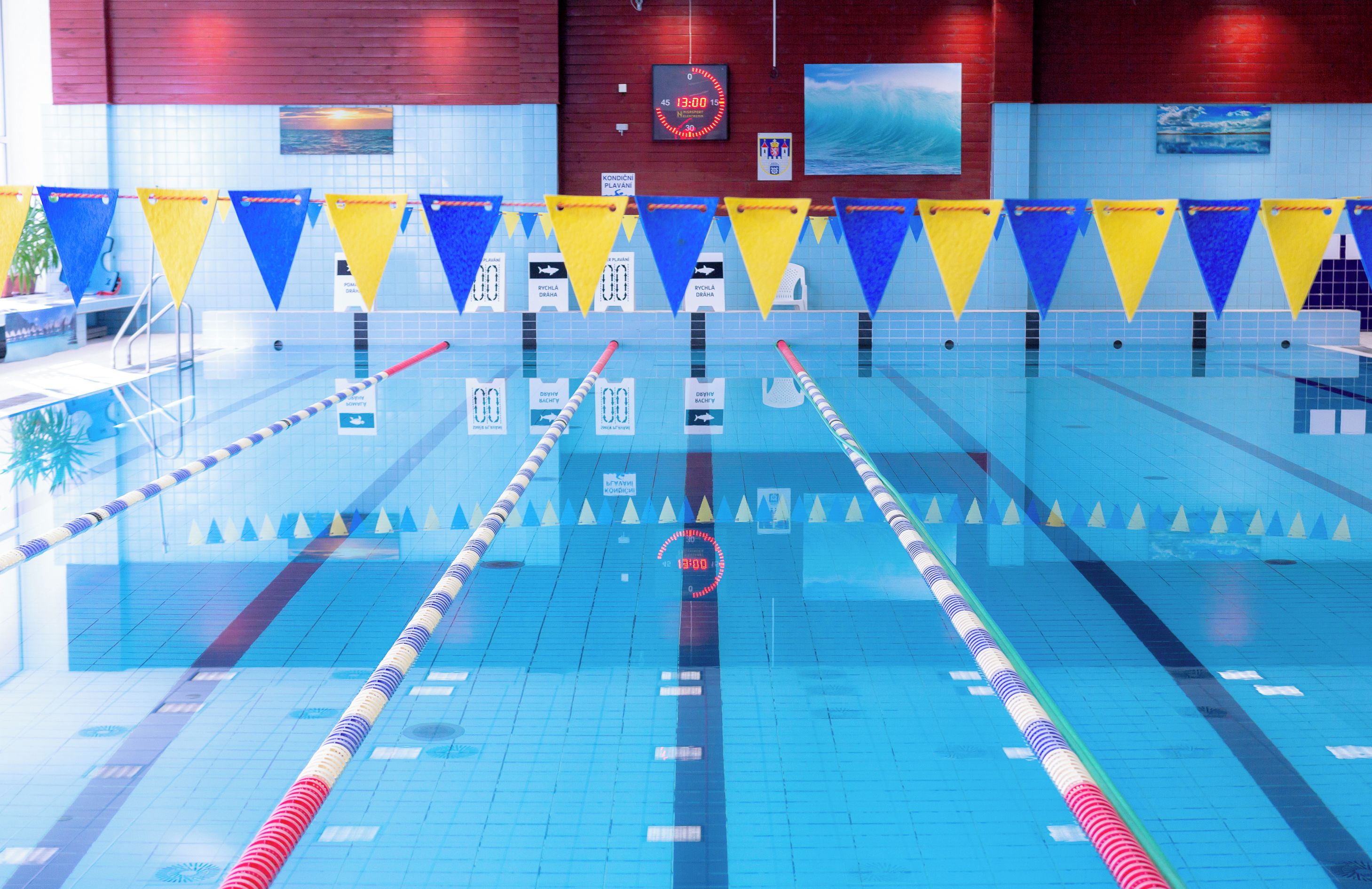 A swimming pool with lane dividers and numbered lanes.
