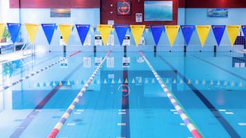 A swimming pool with lane dividers and numbered lanes.