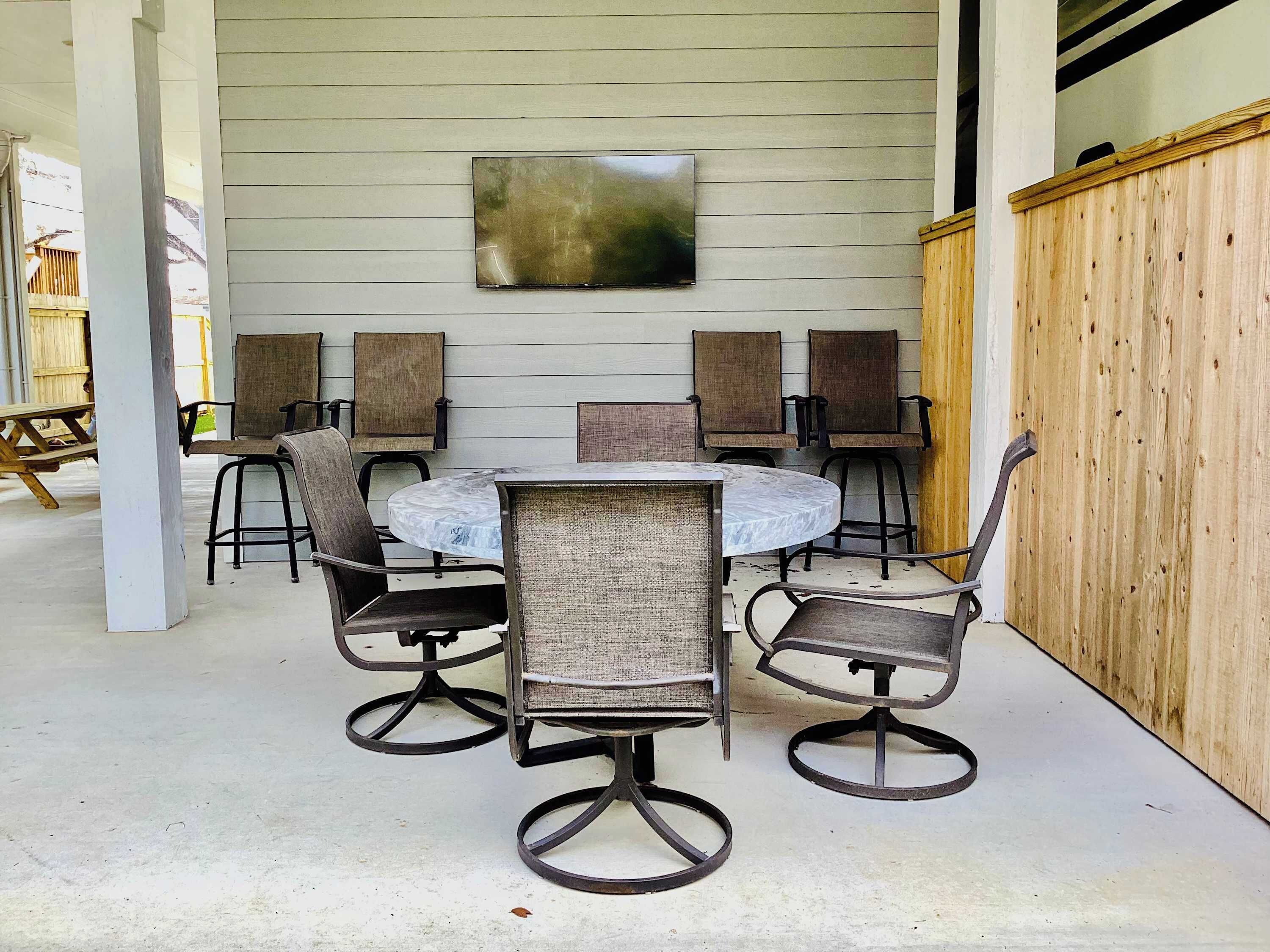 Downstairs patio with smart TV and plenty of seating for everyone