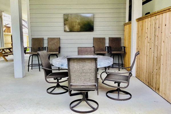 Downstairs patio with smart TV and plenty of seating for everyone