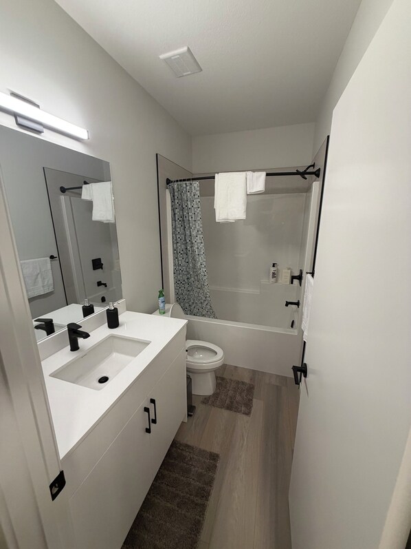Shower, towels, soap, toilet paper