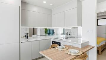 Coffee/tea maker, fridge, microwave, oven