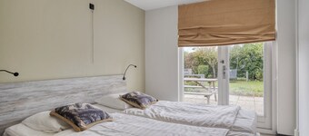 Spacious detached family beach villa with roof terrace and large garden. Fantastically located on the edge of the Oosterschelde.