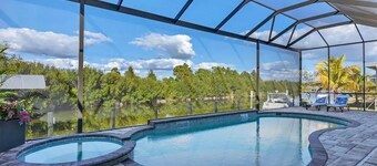 Waterfront private Resort style in South Gulf Cove, heated pool, spa & boat dock