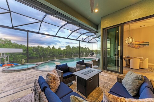 Waterfront private Resort style in South Gulf Cove, heated pool, spa & boat dock