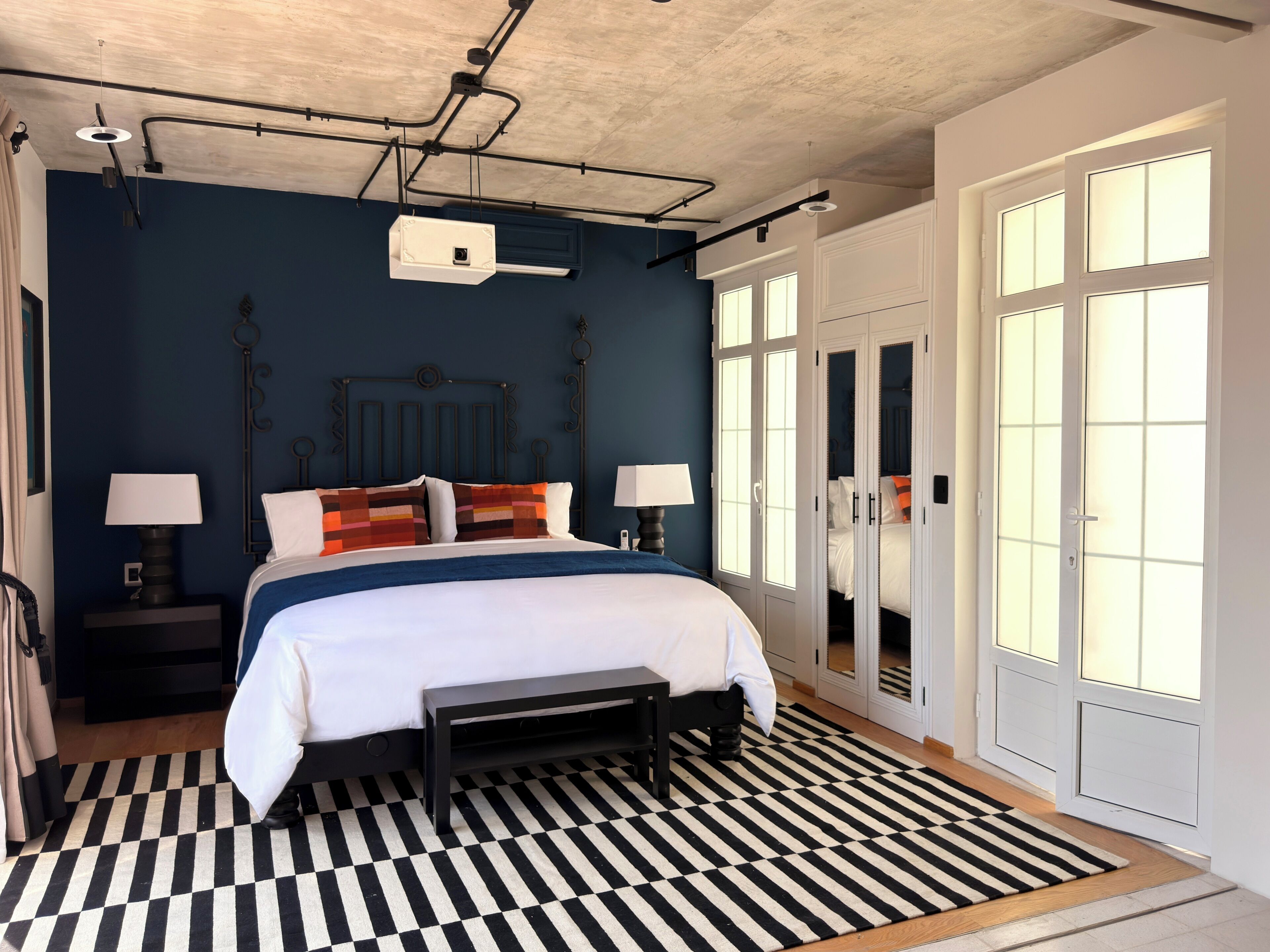 Design Studio Suite, 1 King Bed, City View | Premium bedding, minibar, in-room safe, blackout drapes