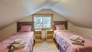 A bedroom with two beds, a window, and a ceiling light. - Great for Families! Heart of Bethlehem (Bethlehem)