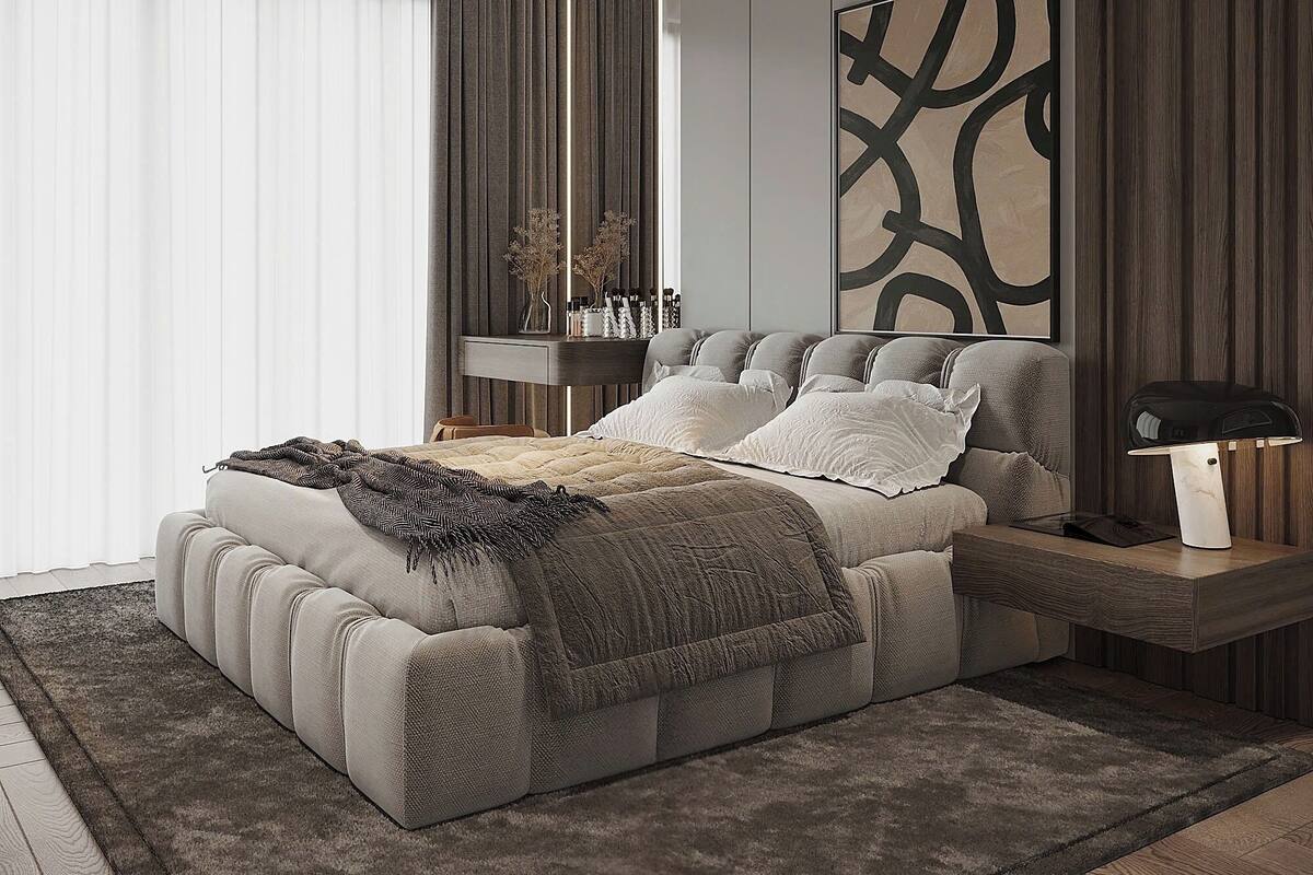 A modern bedroom with a large bed, a bedside table, a nightstand, a wall-mounted lamp, and a decorative piece above the bed.