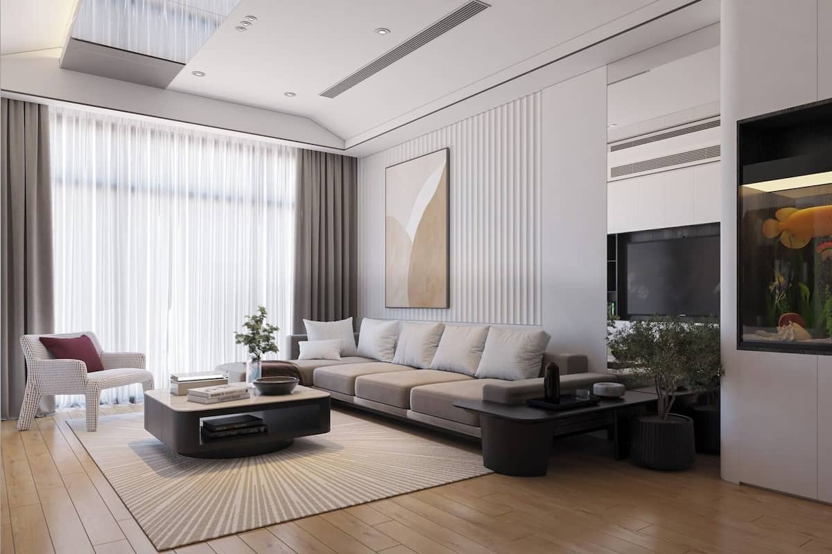 A modern living room with a sofa, coffee table, and a large fish tank.