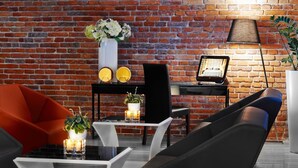 A modern living room with a brick wall, a piano, and a lamp. - Central Kraków Classic King | Ideal for 2 | Free Bfast (Kraków)