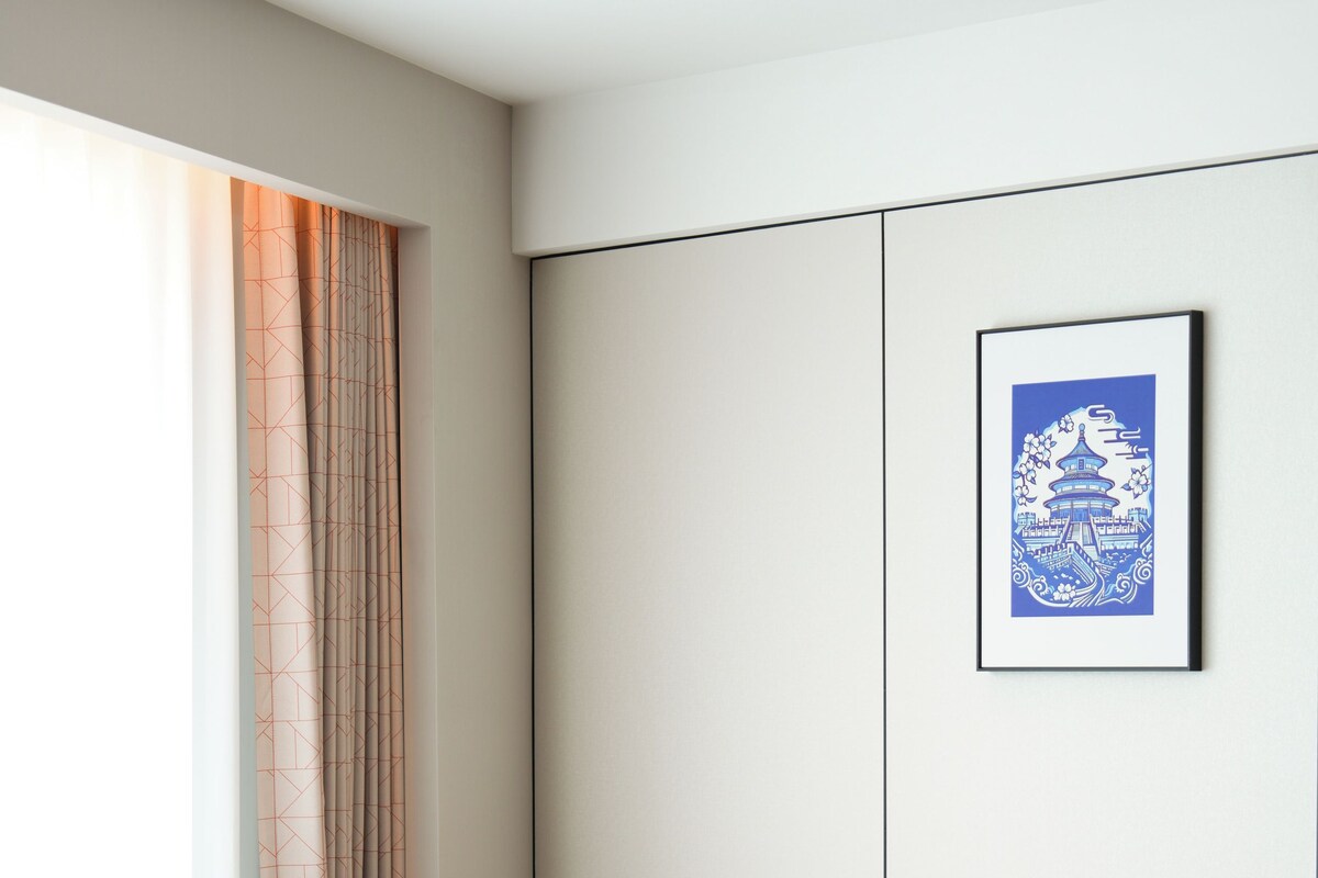 1 King Suite | Living area | 65-inch LCD TV with cable channels