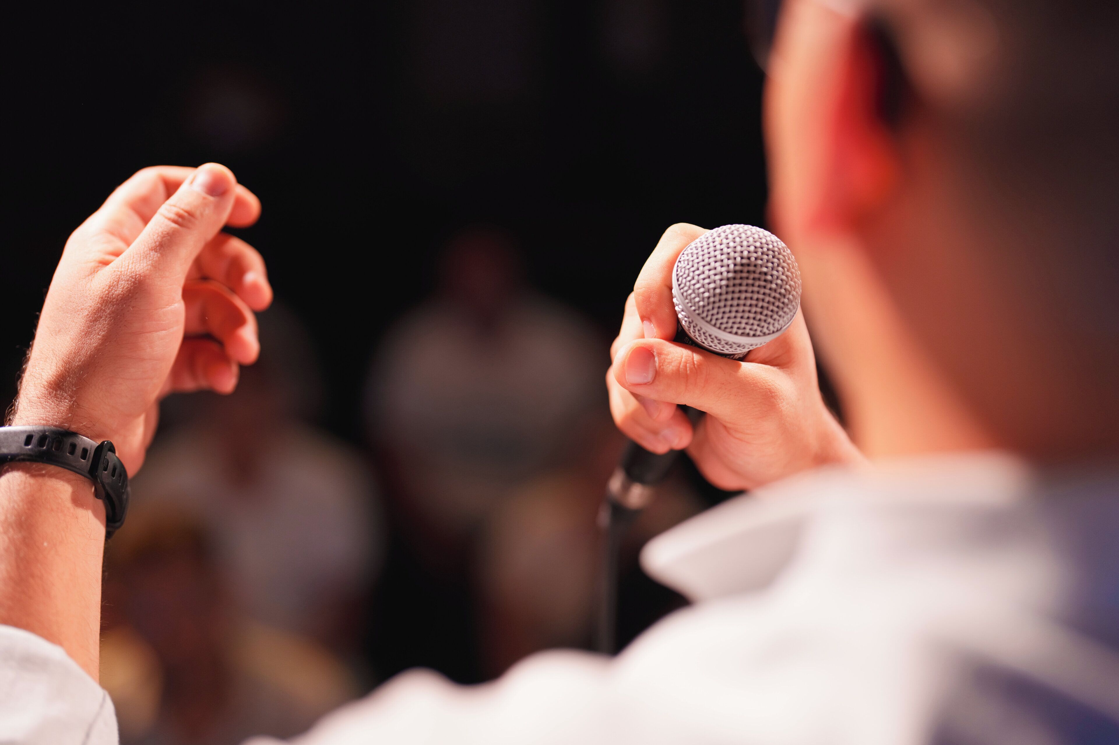 A person holding a microphone.