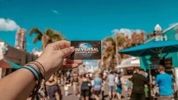 A hand holding a Universal Orlando Resort card.