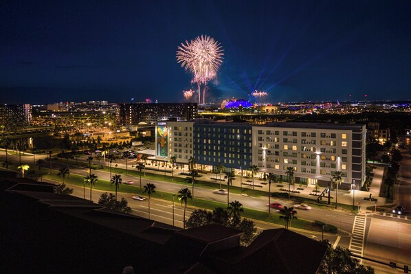 A hotel with a modern design, located near a busy street and a parking area. - Even Hotel Orlando Universal Blvd By Ihg (Orlando)
