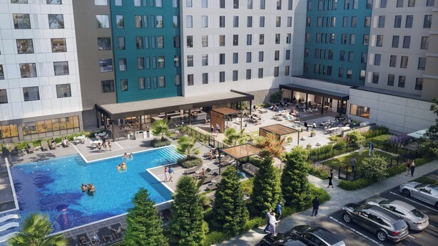 A modern hotel with a rooftop pool, outdoor seating areas, and a covered patio. - Even Hotel Orlando Universal Blvd By Ihg (Orlando)
