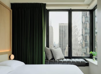 Premium bedding, pillowtop beds, free minibar, in-room safe at Kimpton Era Midtown New York By Ihg