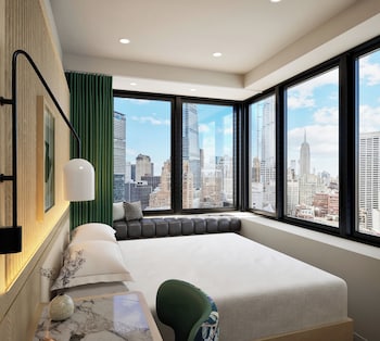 Premium bedding, pillowtop beds, free minibar, in-room safe at Kimpton Era Midtown New York By Ihg