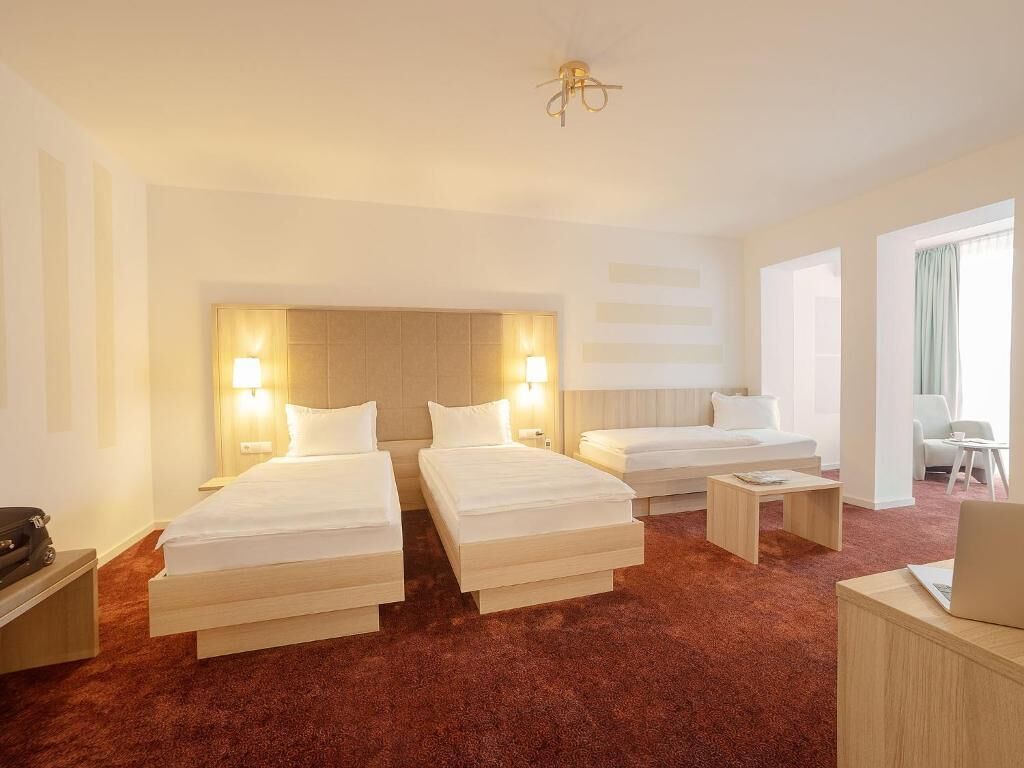 Triple Room, Courtyard View | Premium bedding, down comforters, minibar, in-room safe