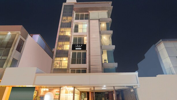 A multi-story hotel with a modern design, featuring a prominent 'Collection' sign on the facade. - Super Collection O Airport Road Hotel (Ahmedabad)