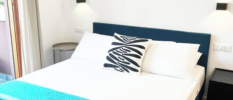 Egyptian cotton sheets, premium bedding, laptop workspace