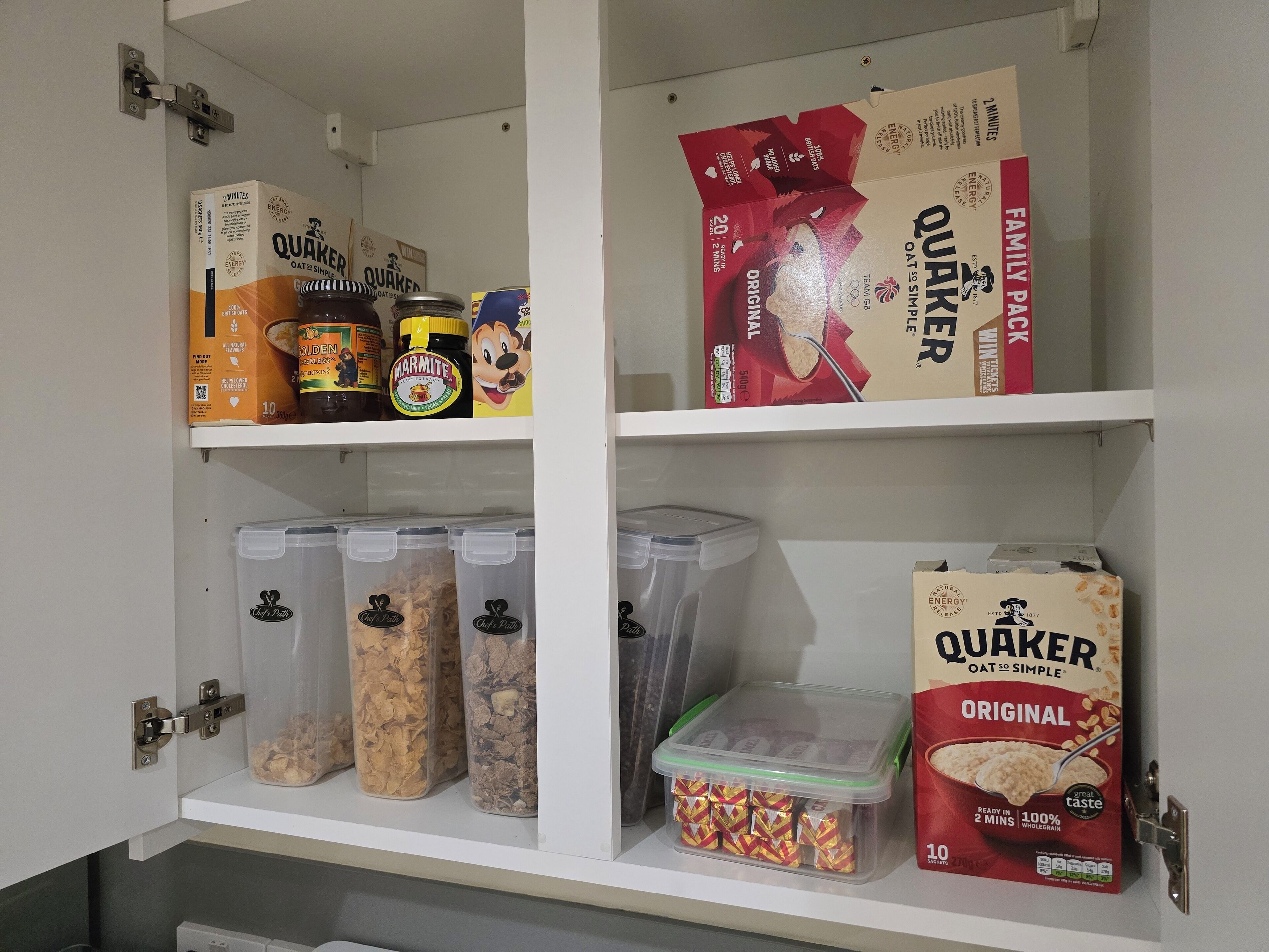 A pantry with Quaker Oatmeal, Marmite, and other food items.