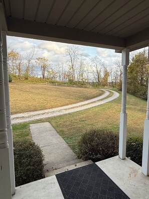Property grounds - Relaxing 2-bedroom house on a back country road.
Private deck in wooded area. (Logan)