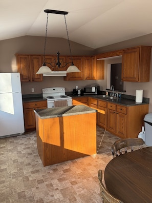 Fridge, microwave, stovetop, coffee/tea maker - Relaxing 2-bedroom house on a back country road.
Private deck in wooded area. (Logan)