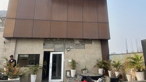 A modern building with a large entrance and a sign above it. - Staylo Masterprice Palace (Lucknow)