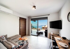 Apartamento luxo, vista para o mar | Área de estar
